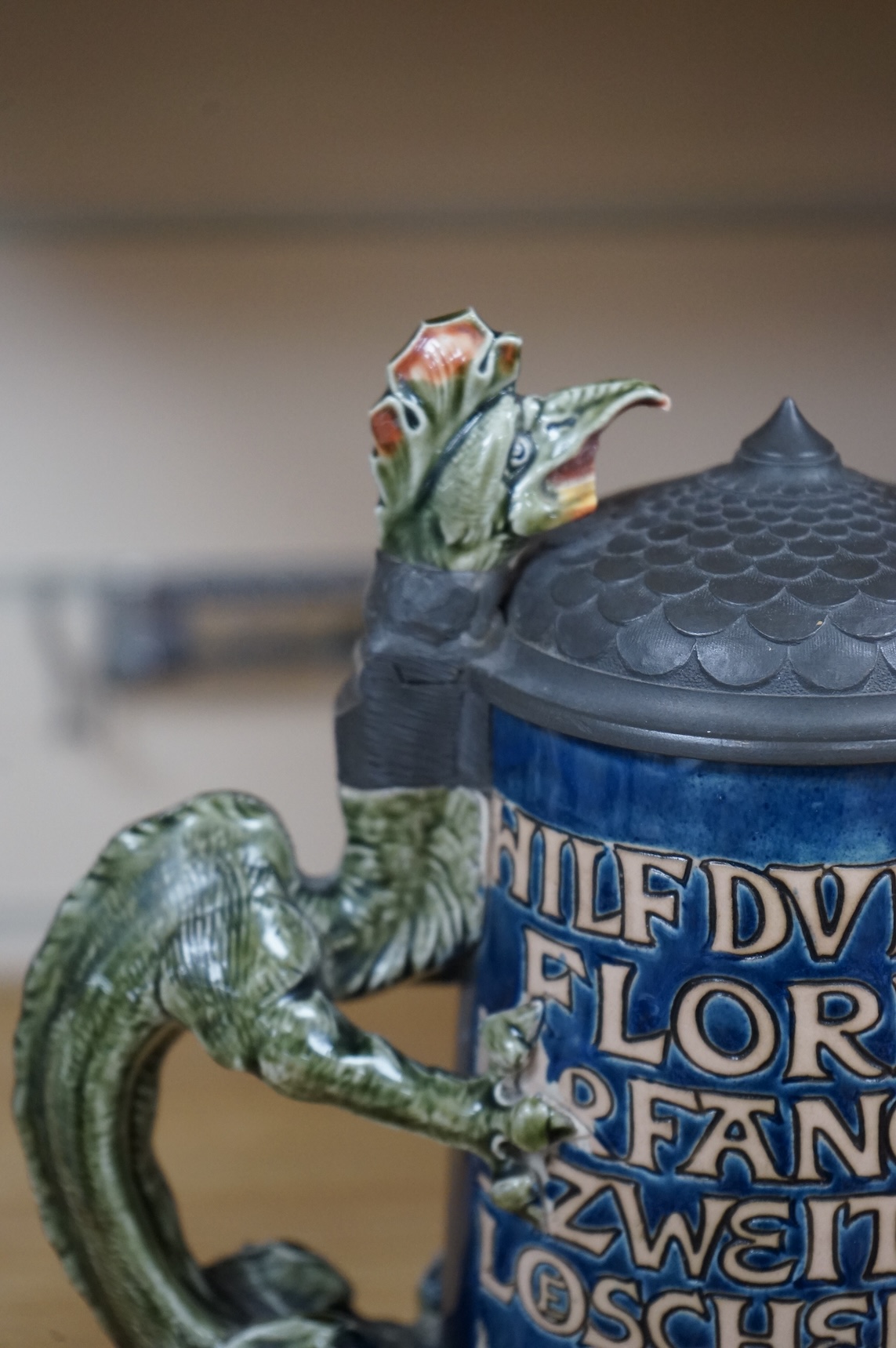 A Mettlach ‘ St Florian‘ stoneware stein, 27cm